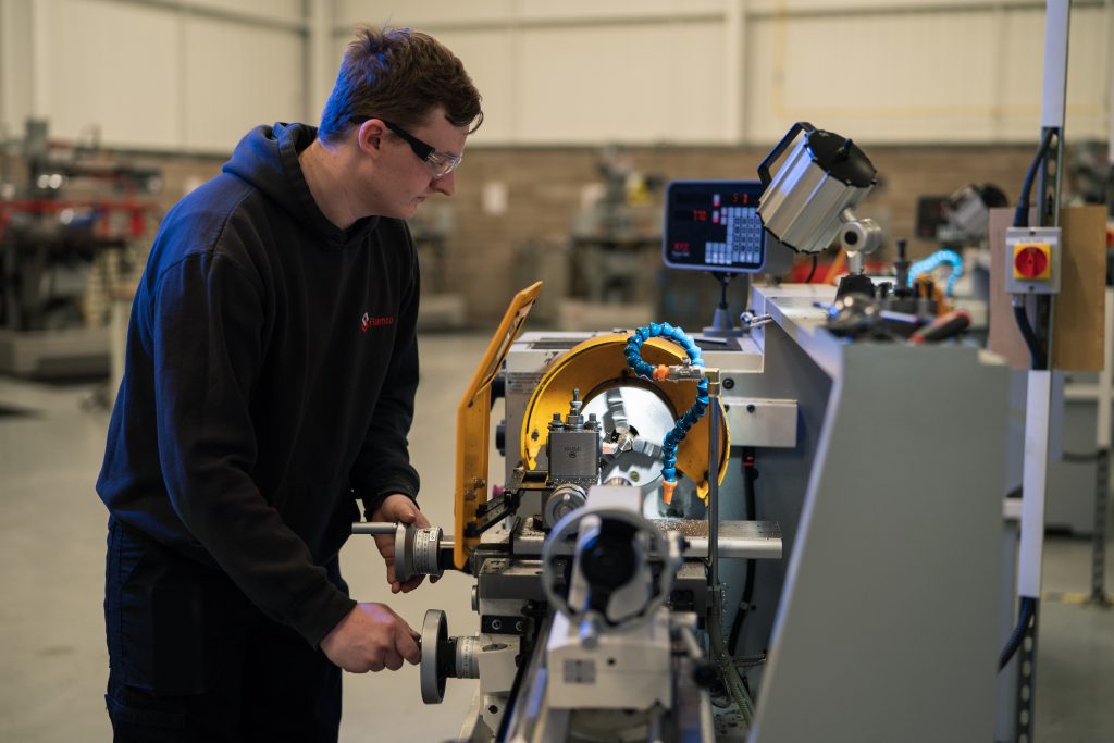 Student operating machinery
